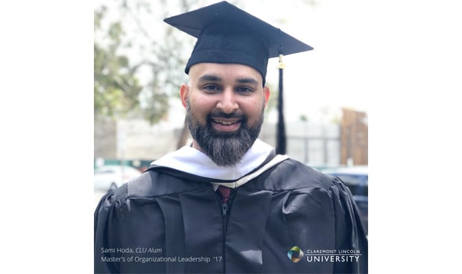 151831601_sami_hoda copy a man standing outside in a graduation cap and gown