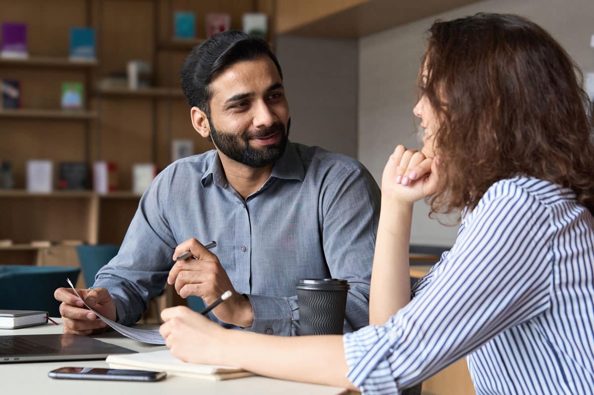 A human resources consultant meeting with a colleague in an office.