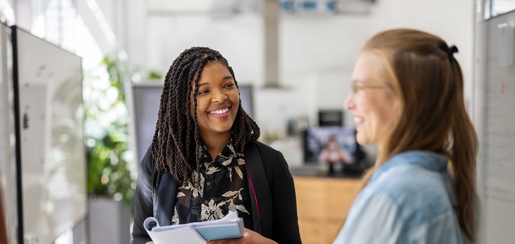 ONLINE EXECUTIVE CLU CORE® certificate two business executives having a conversation in an office setting