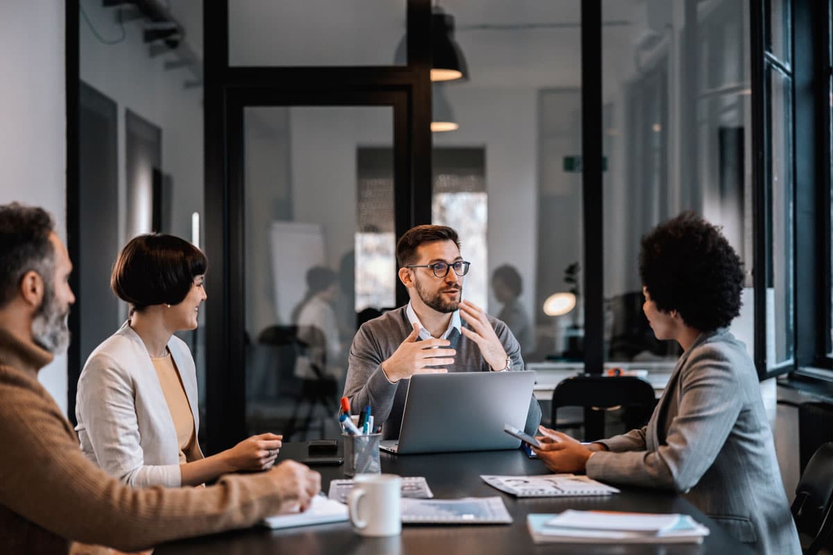 Members of a nonprofit board meet around a conference table.